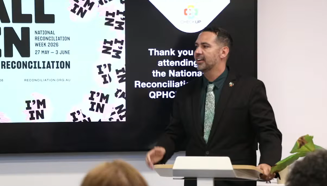 Kieran Chilcott MC addressing the room at the National Reconciliation Week event