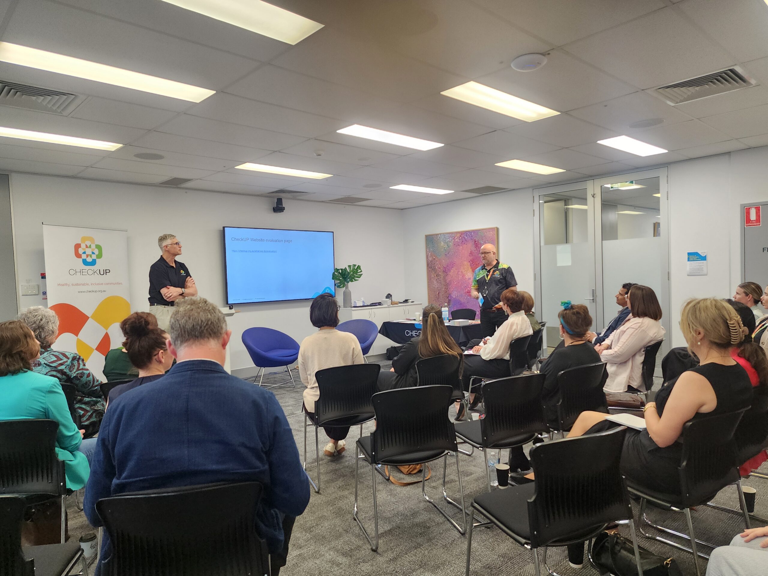 Tony de Ambrosis addressing attendees at the QPHCN event